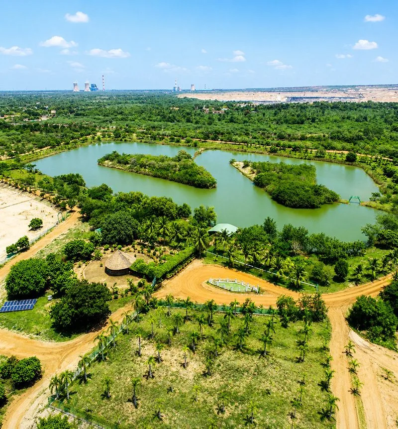 A former mine site reclaimed into a green lake and park